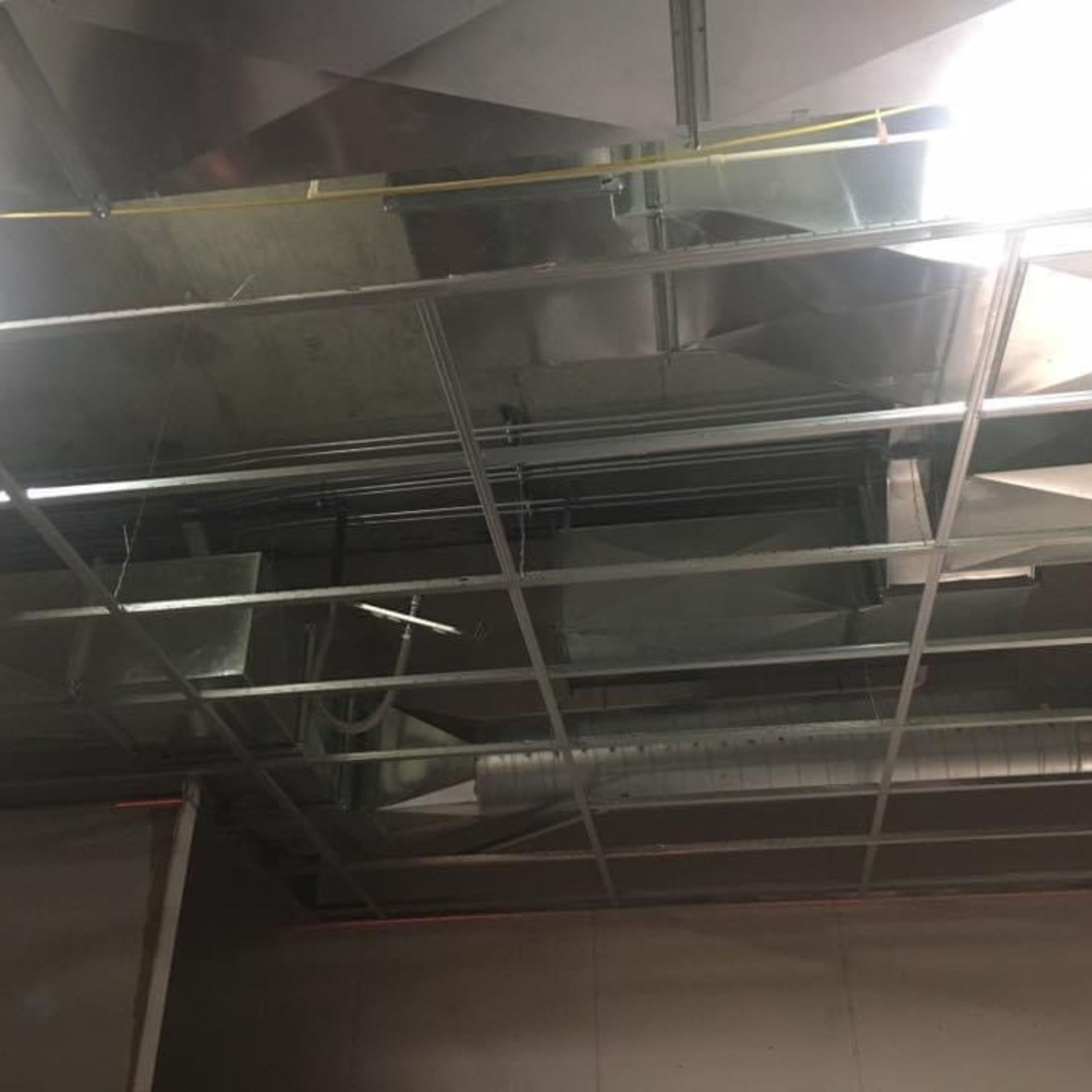 Lake Area Heating and Cooling LLC | A ceiling with a lot of pipes hanging from it.
