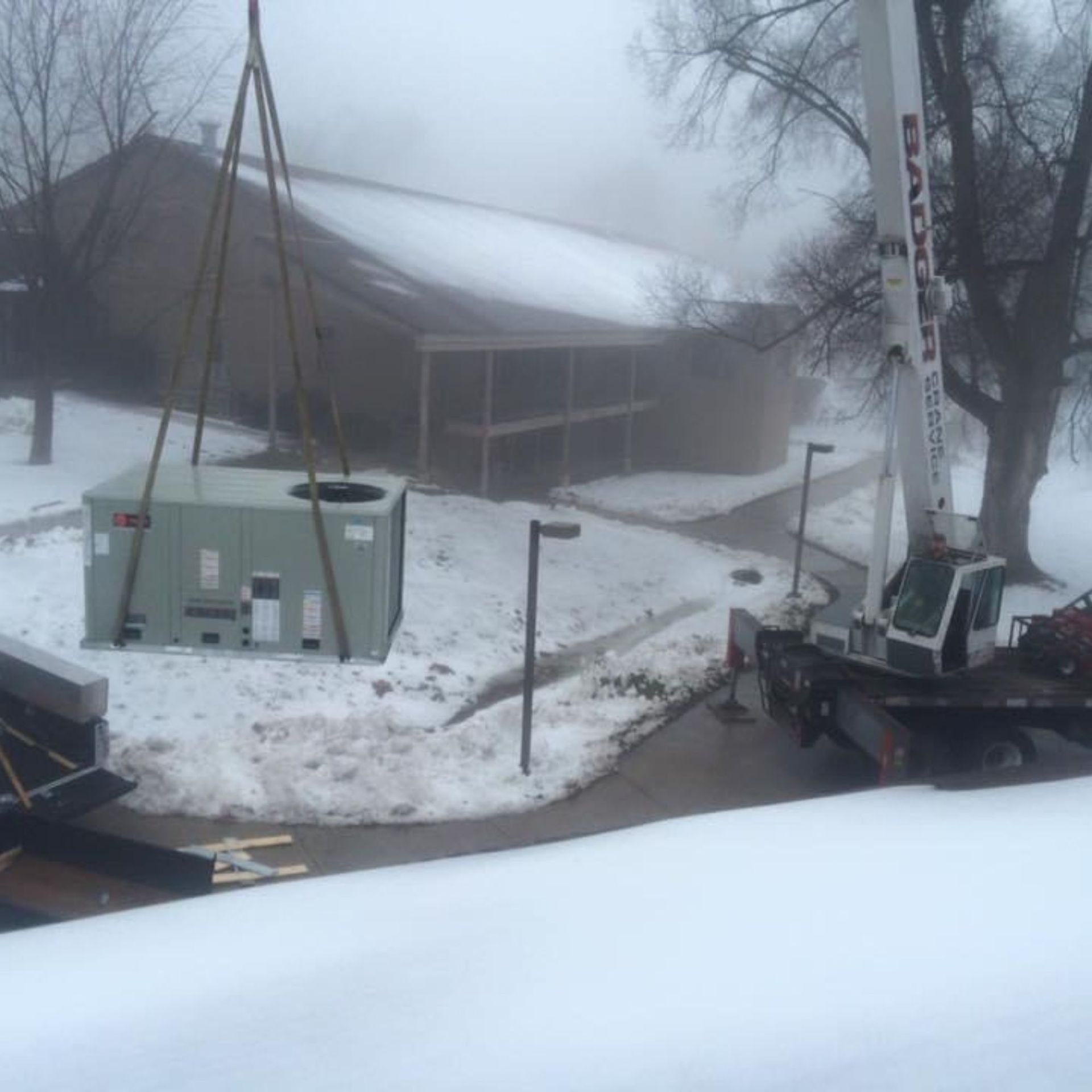 Lake Area Heating and Cooling LLC | A crane with the word sanyo on it