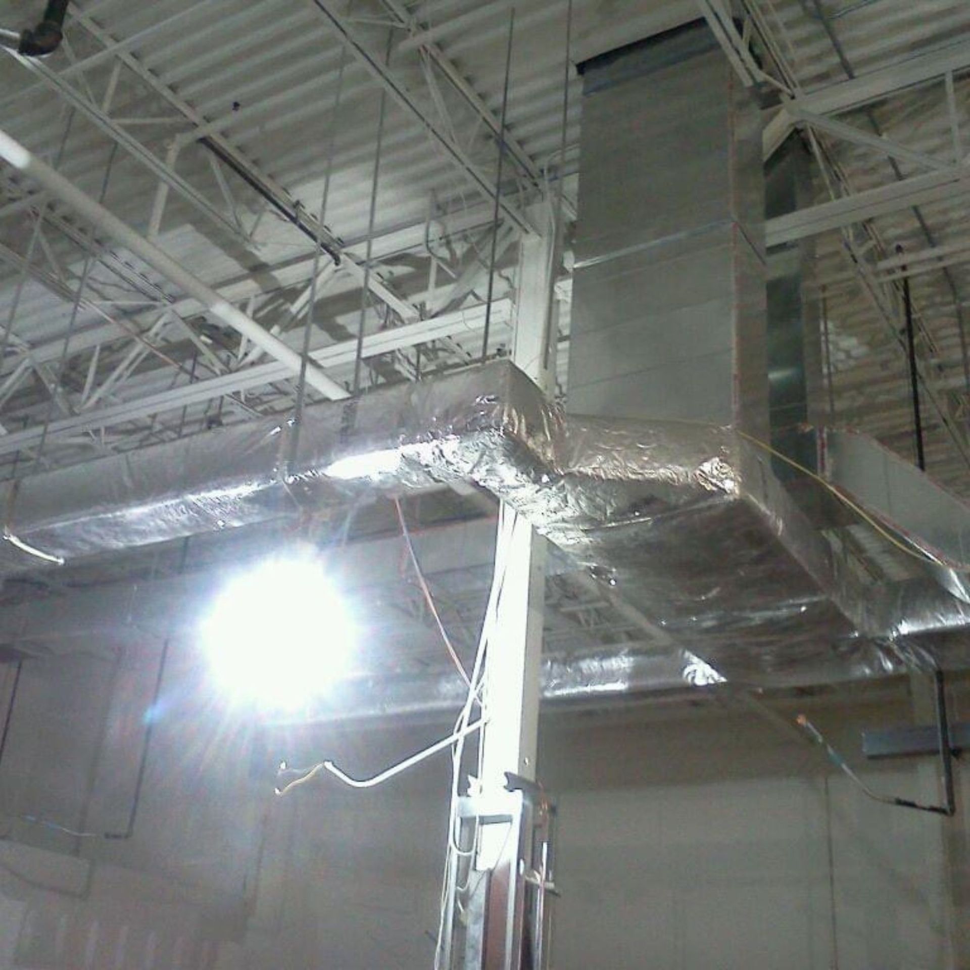 Lake Area Heating and Cooling LLC | A ceiling with a lot of wires hanging from it