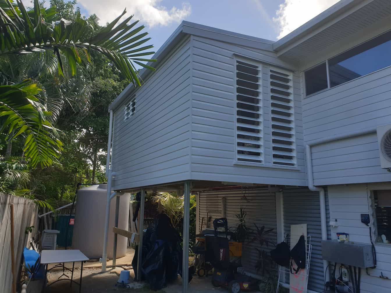 A White House With a Porch and a Table in Front of It — Gaspen Builders & Carpenters in Kirwan, QLD