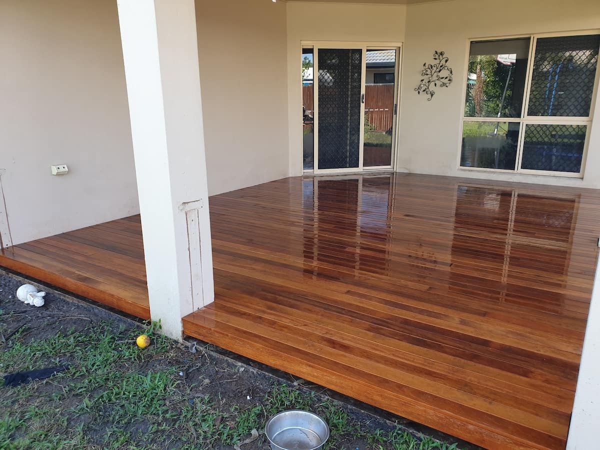 There is a Wooden Deck in the Backyard of a House — Gaspen Builders & Carpenters in Kirwan, QLD