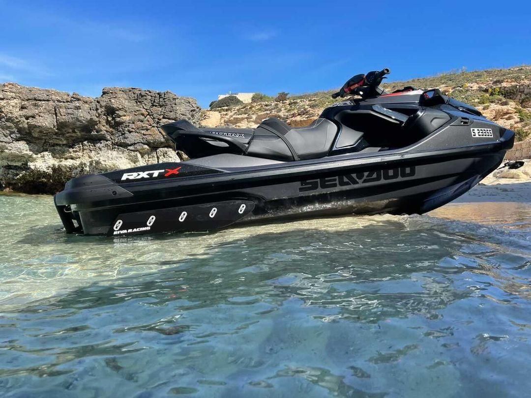 A jet ski is floating on top of a body of water.