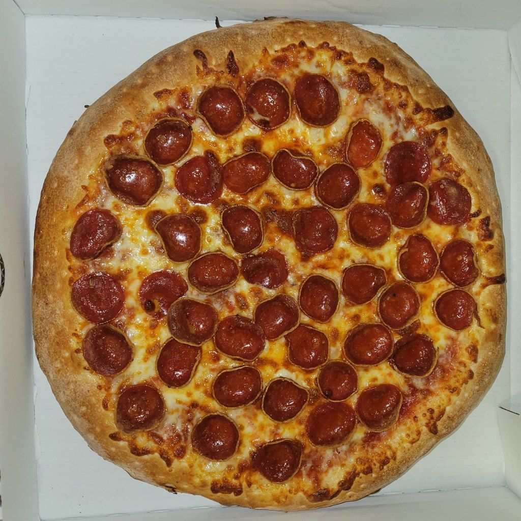 Pepperoni pizza in a box.