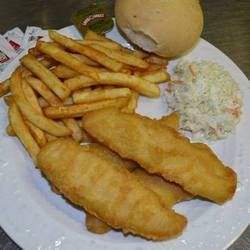 Plate of fried fish, fries, coleslaw, and a bun.