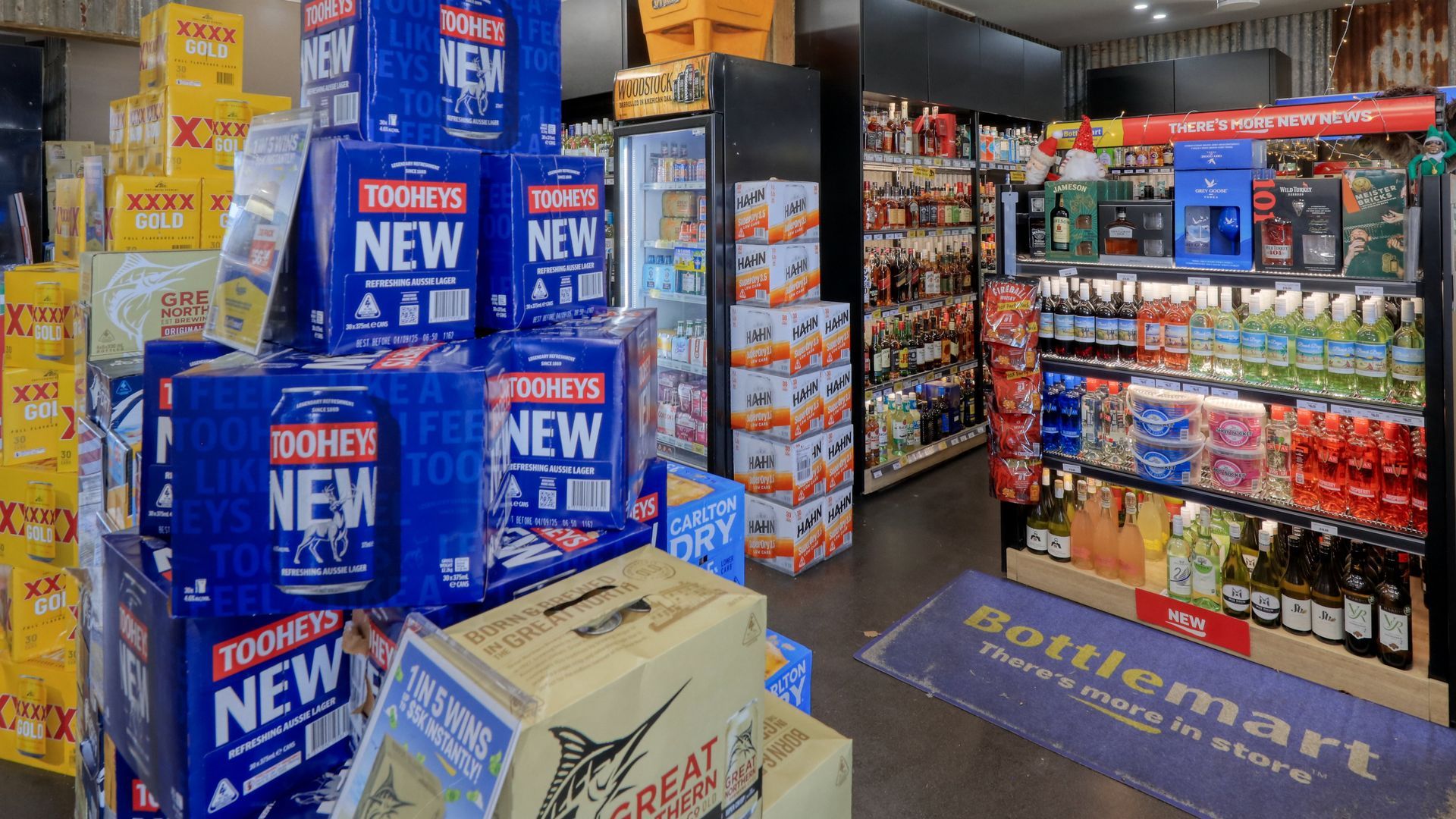 A store filled with lots of boxes of beer.