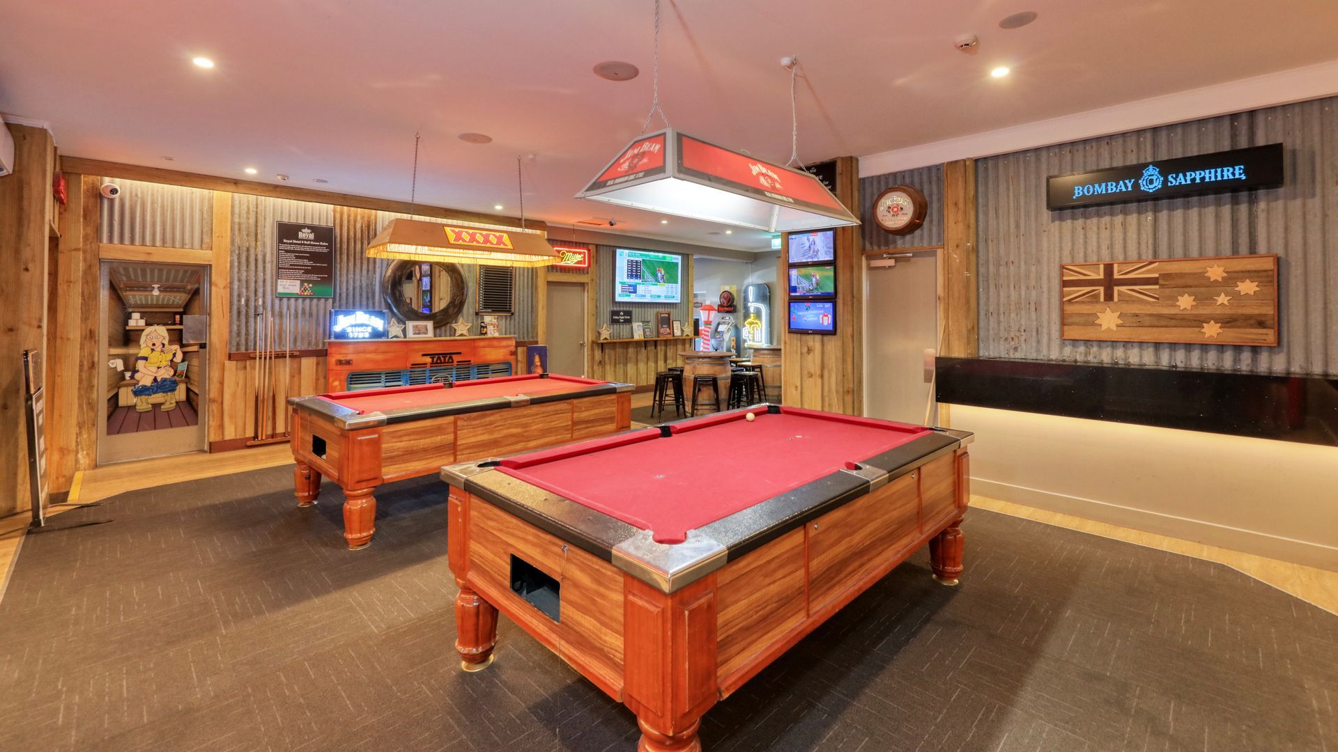 There are two pool tables in the room.