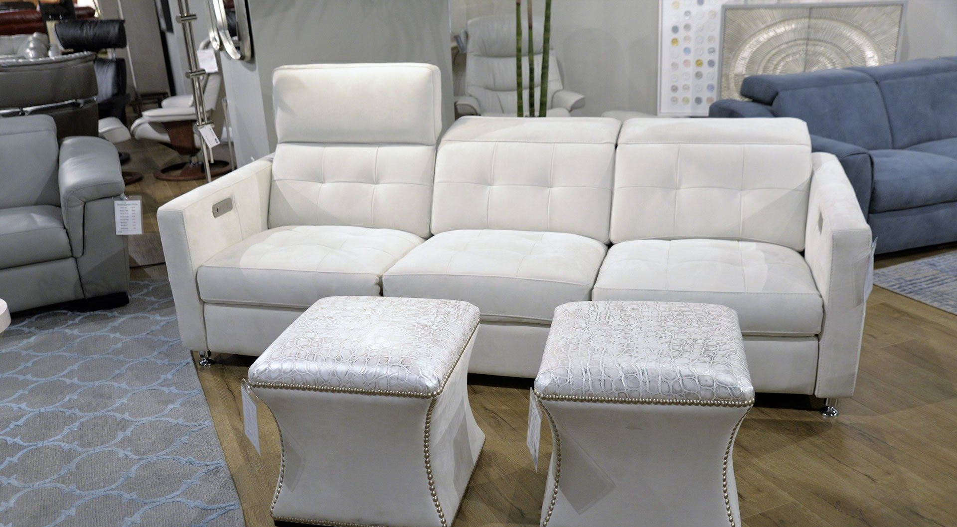 white couch and foot rests