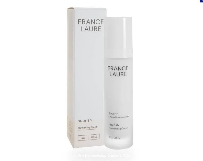 A bottle of france laure next to its box