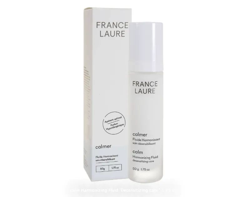 A bottle of france laure next to its box