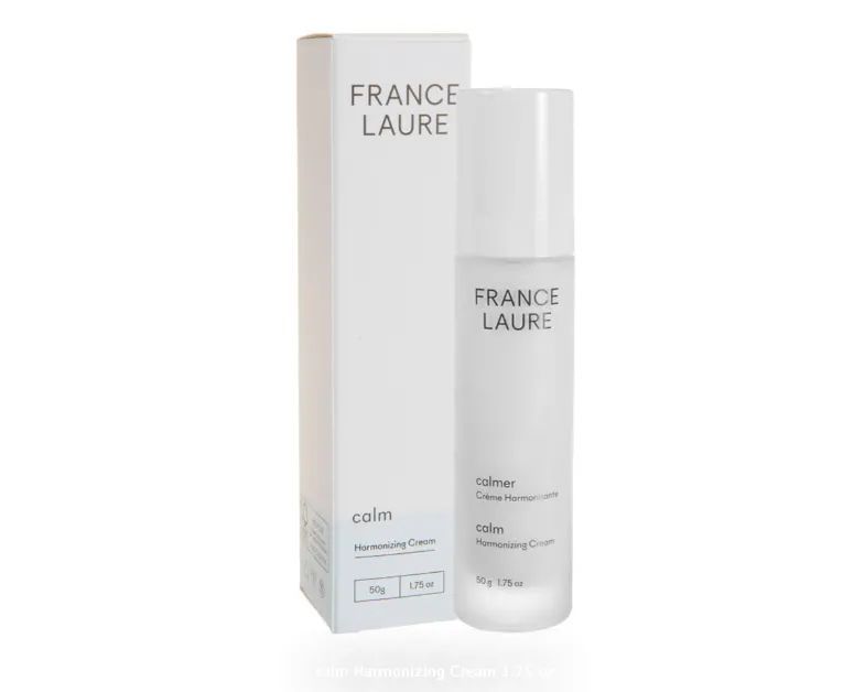 A bottle of france laure next to its box