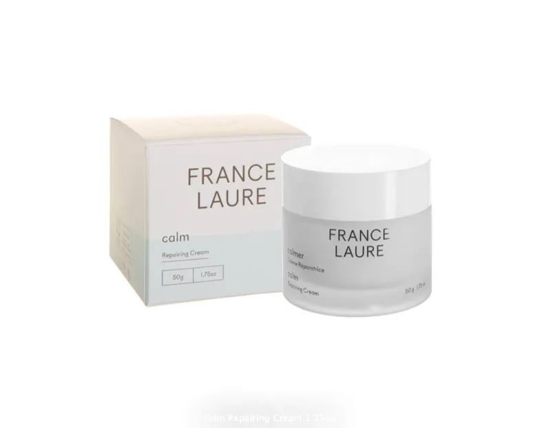 A jar of france laure cream next to a box.