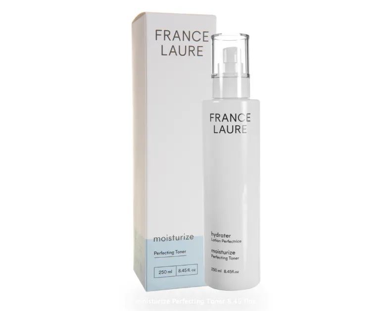 A bottle of france laure next to its box