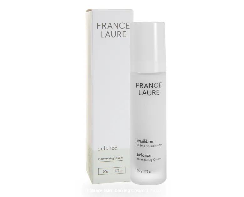 A bottle of france laure balance next to its box