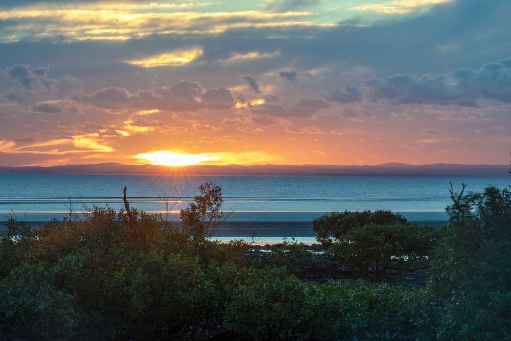 Sunset Over Water; Orange and Yellow Sky — Watkins Electrical In K'gari, QLD