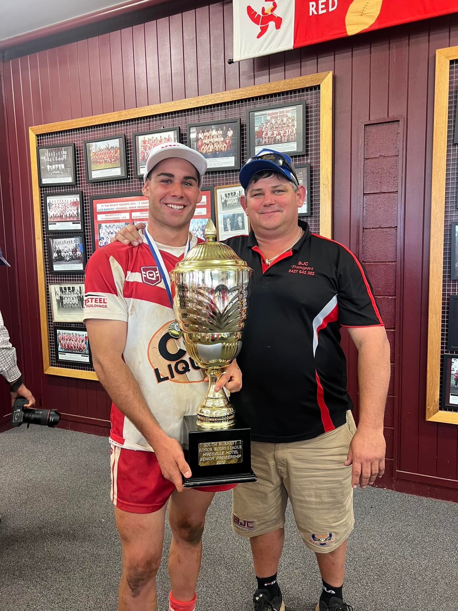 A Semi Truck Is Being Loaded With Grain By A Crane — BJC Transport In Wondai, QLD