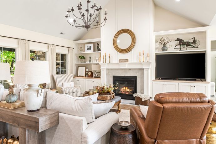 A kitchen with a large island and a fireplace
