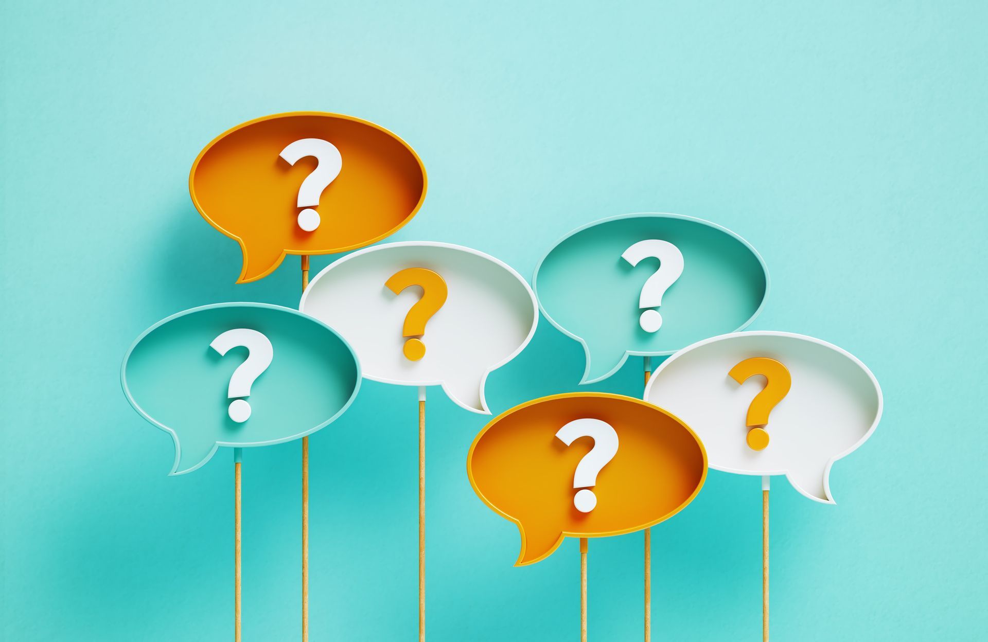 Question Marks Written Speech Bubbles On teal Background.