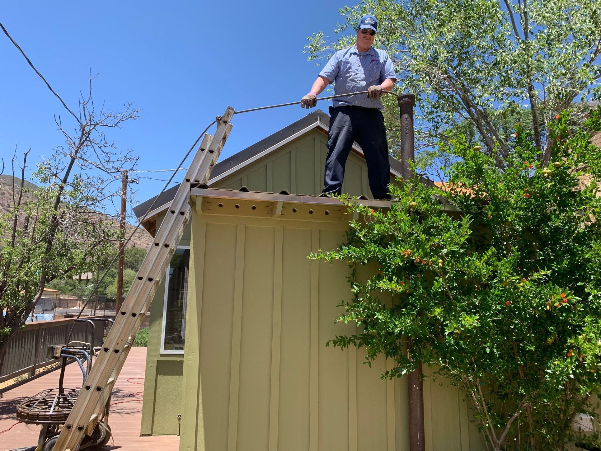 Plumber Going Down The Sewer Hole — Sierra Vista, AZ — Roto Rooter Sewer and Drains Plumber Going Down The Sewer Hole — Sierra Vista, AZ — Roto Rooter Sewer and Drains