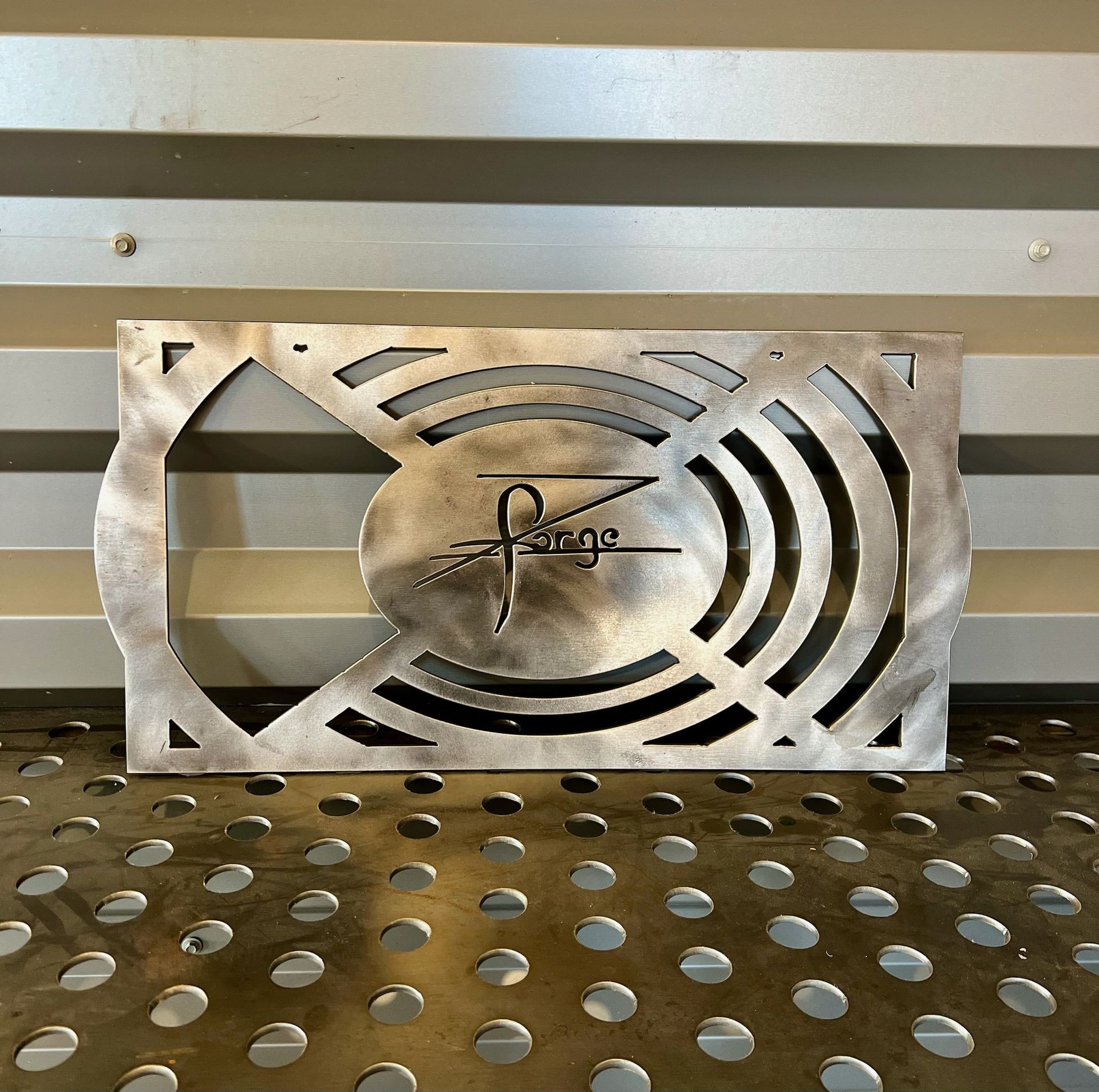 A piece of metal with the letter p on it