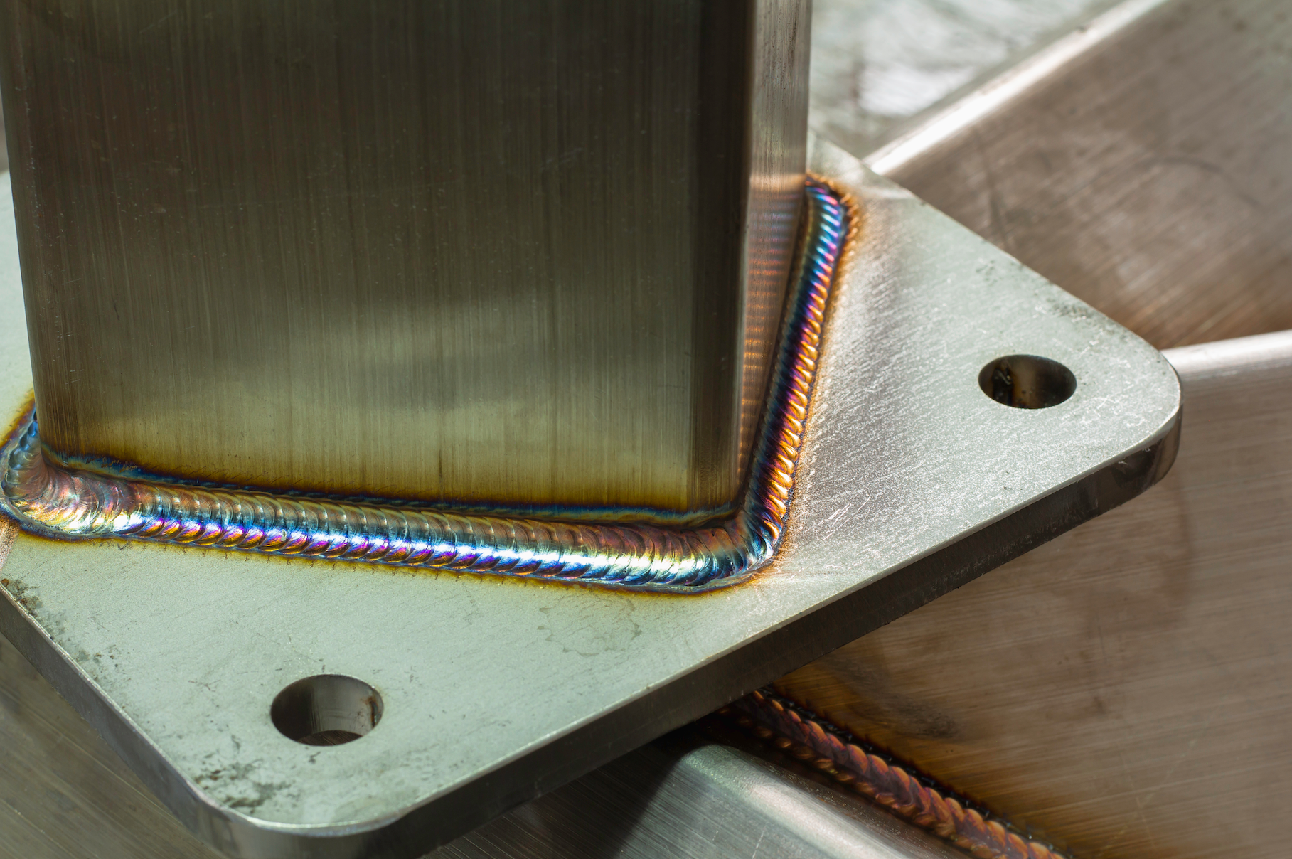 A close up of a piece of metal being welding.