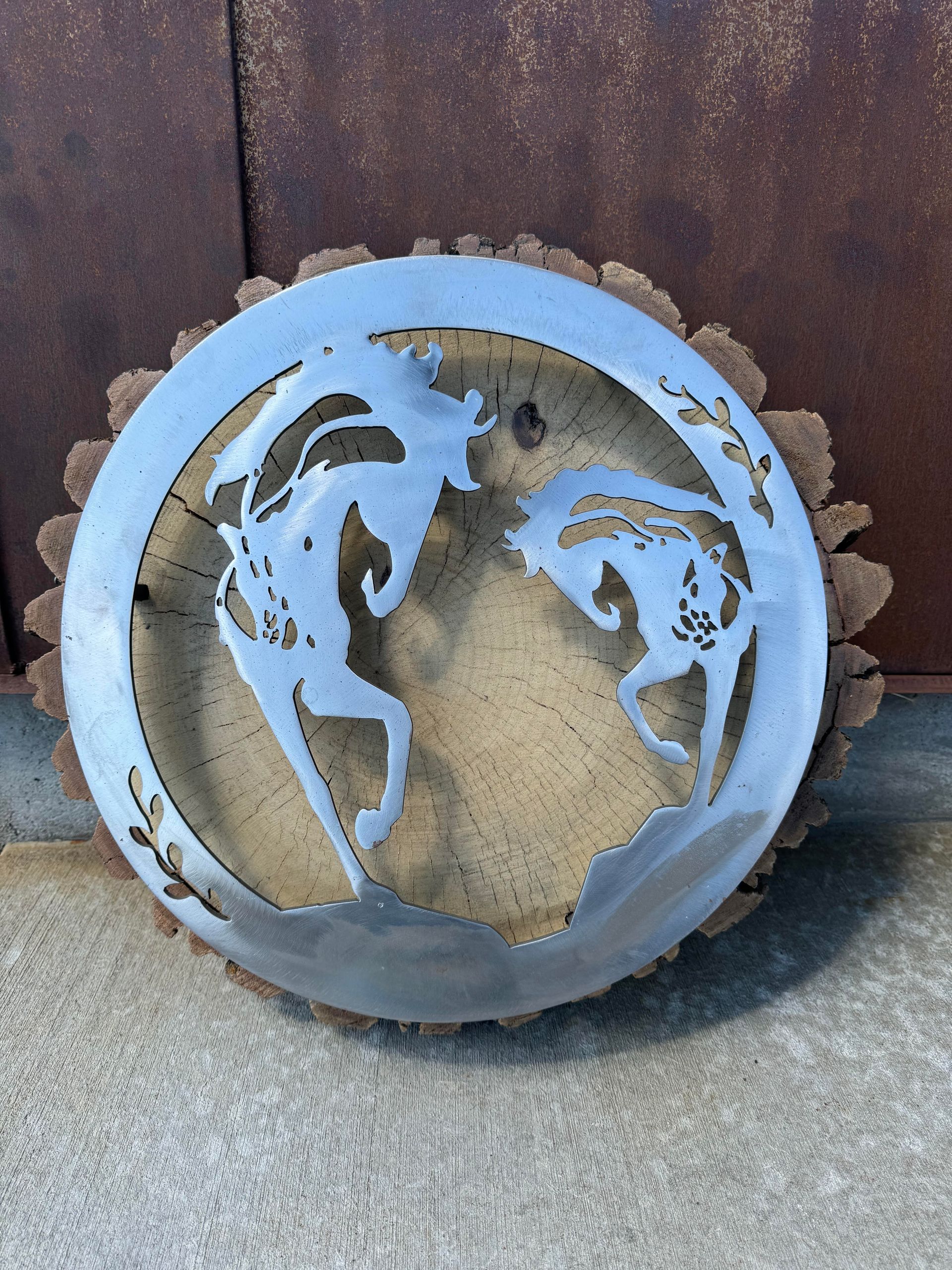 A metal circle with a deer on it