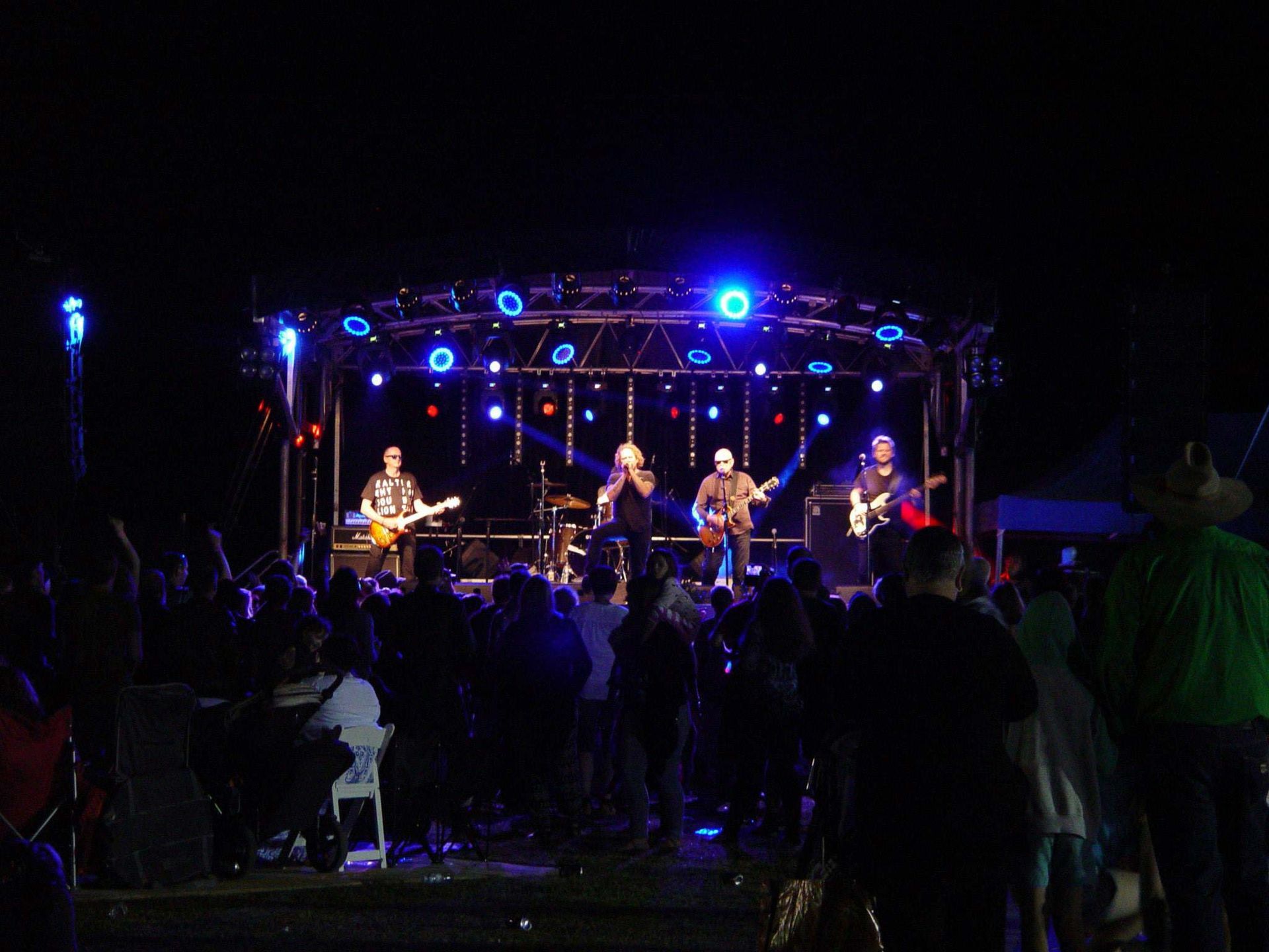 Four Performers On The Stage With A Lot Of Audience β Kennedy Amplifier Hire Service In Mackay QLD