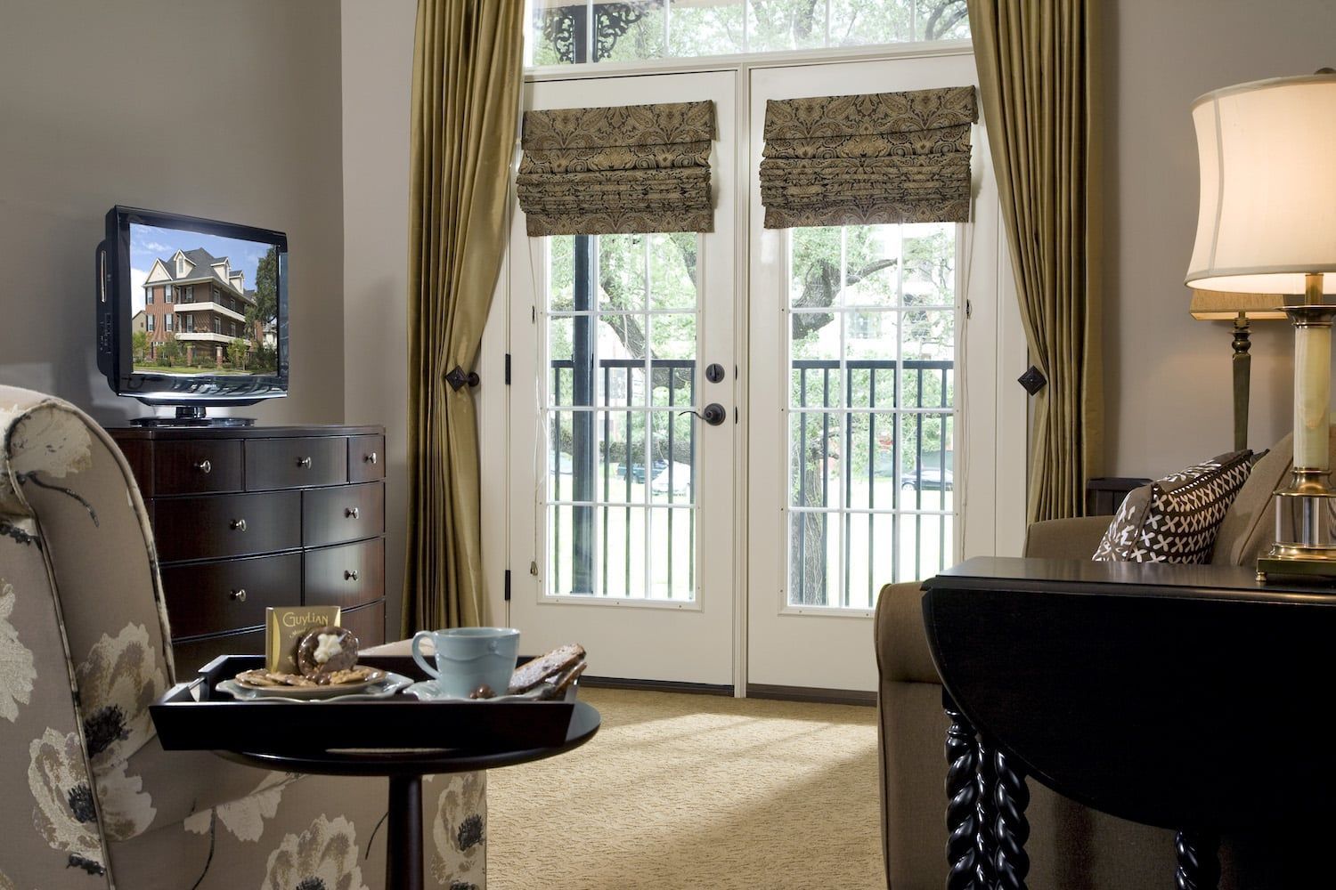 A living room with a couch a table and a television