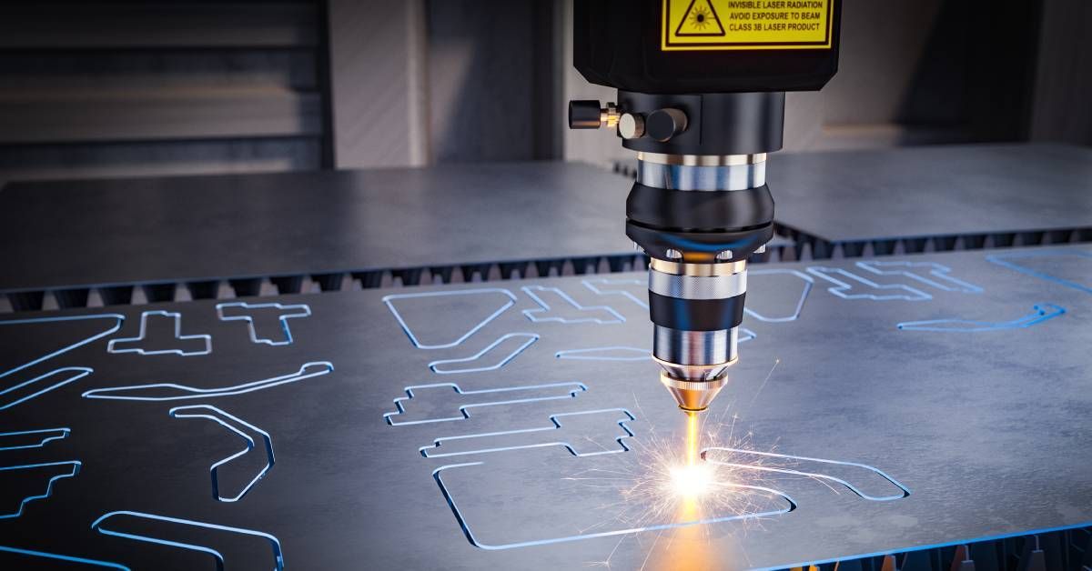 A CNC machine using a laser to cut different shapes out of a large piece of sheet metal moving along underneath.