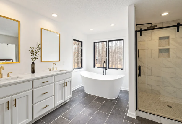 Bright modern bathroom with double vanity, freestanding tub, and glass walk-in shower