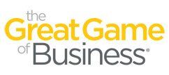 The great game of business logo is yellow and gray.