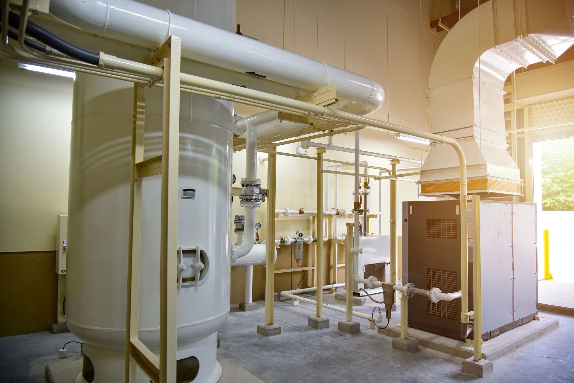 A Large Room With A Lot Of Pipes And Tanks — Federal Way, WA — State Plumbing Utilities