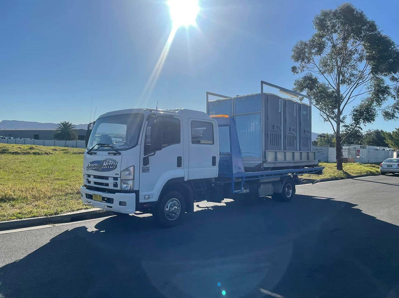 A White Truck is Parked on the Side of the Road — Quick Hitch Towing & Tilt Tray Services Illawarra in Oak Flats, NSW