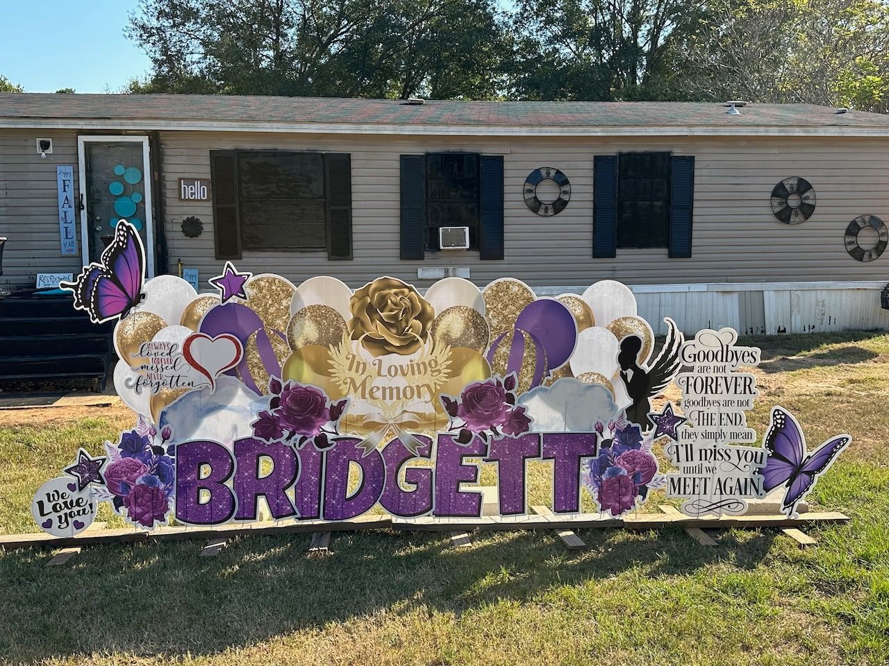 A sign that says bridgette is in front of a mobile home.