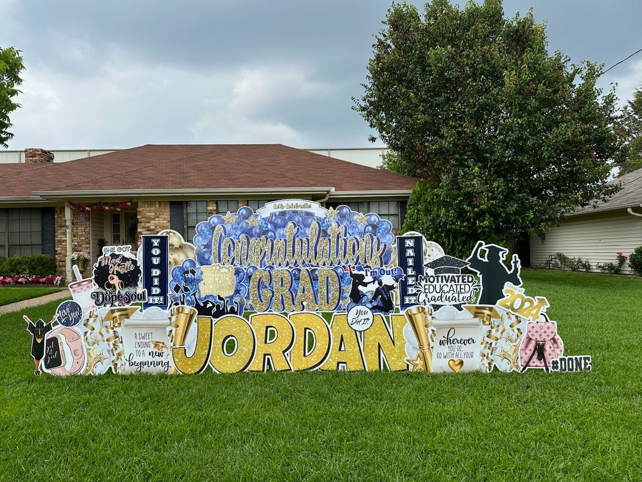 A yard sign for jordan is in front of a house.