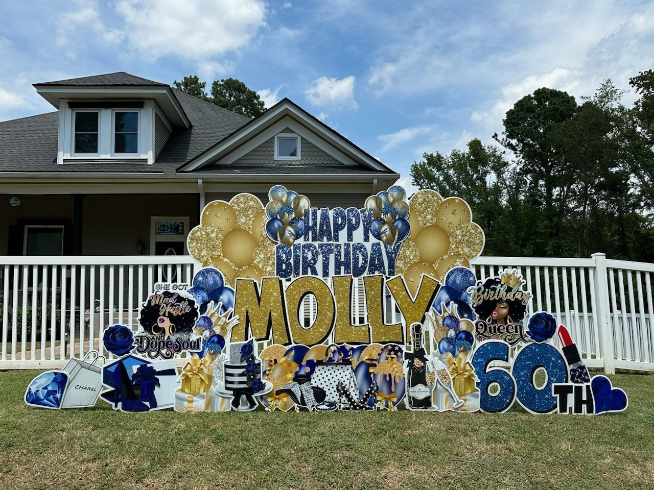 A happy birthday sign for molly is in front of a house.
