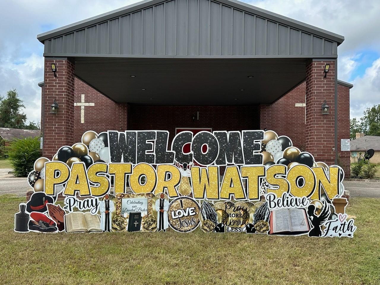 A welcome sign for pastor watson is in front of a church.