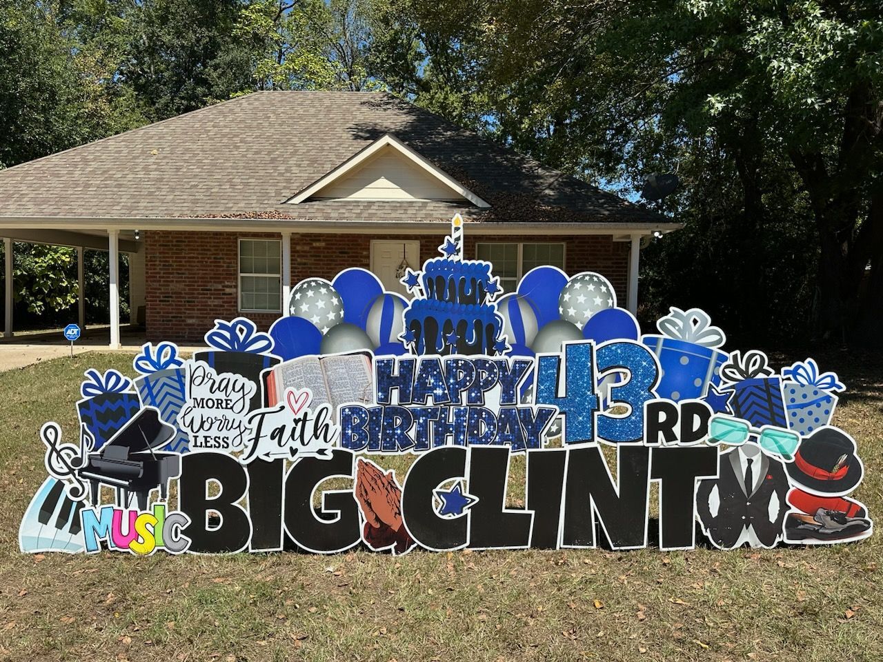 A happy 13th birthday sign in front of a house