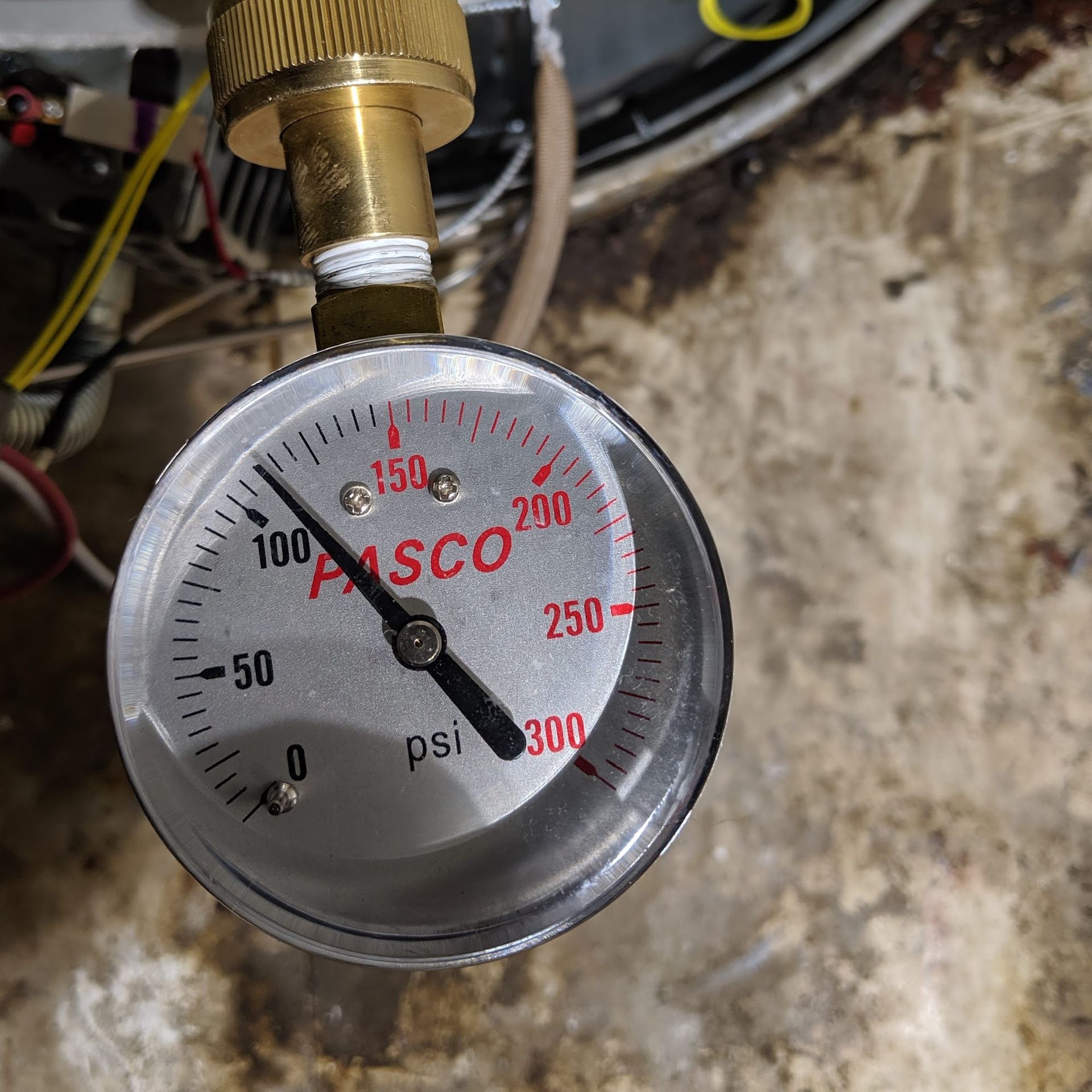 Pressure gauge reading approximately 160 psi, connected to a brass fitting.