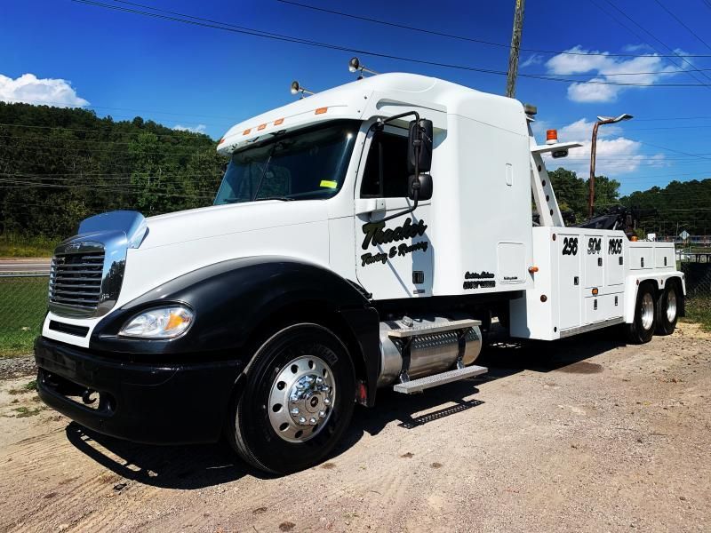 White and black tow truck with 