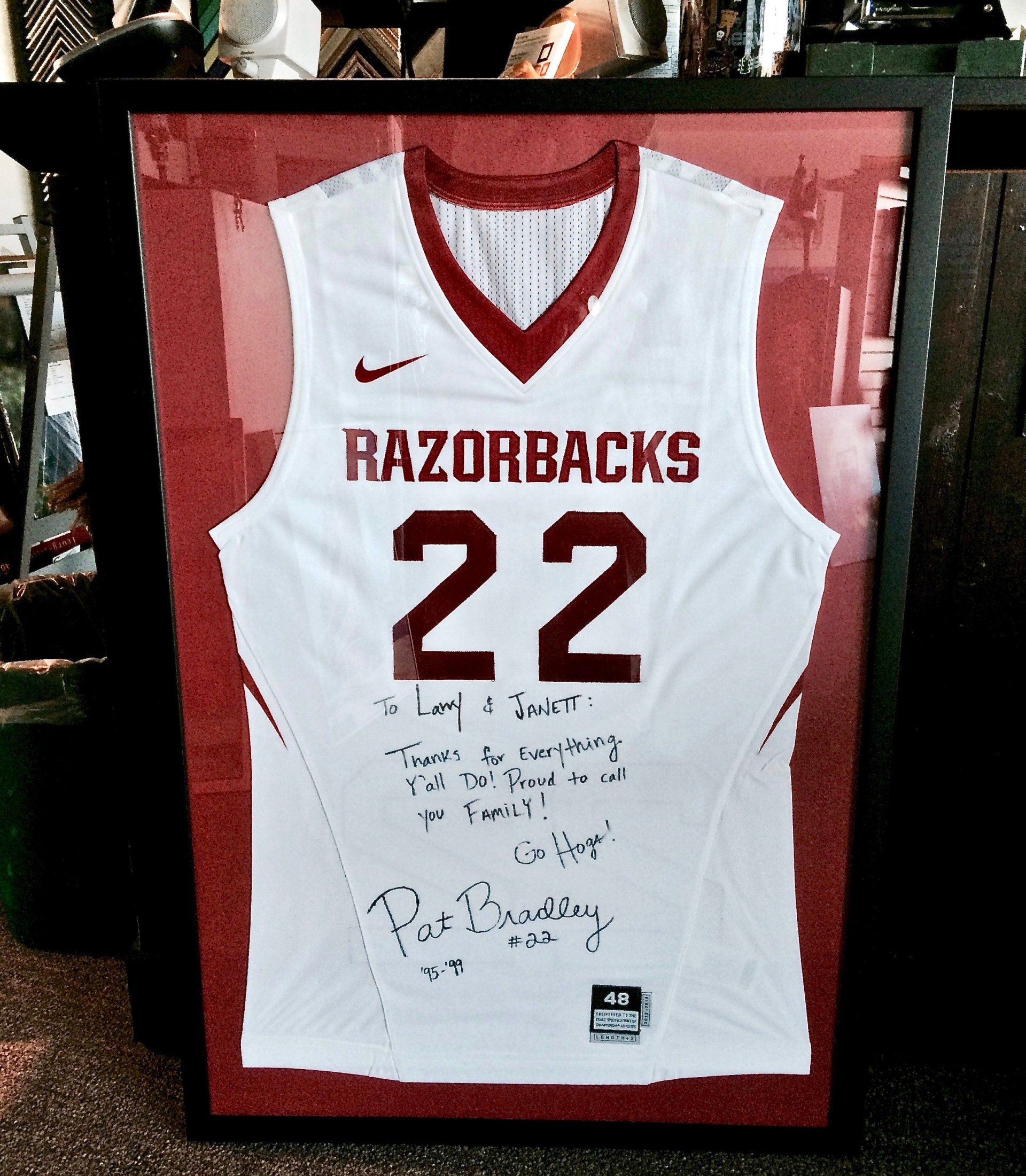 A framed razorbacks basketball jersey number 22