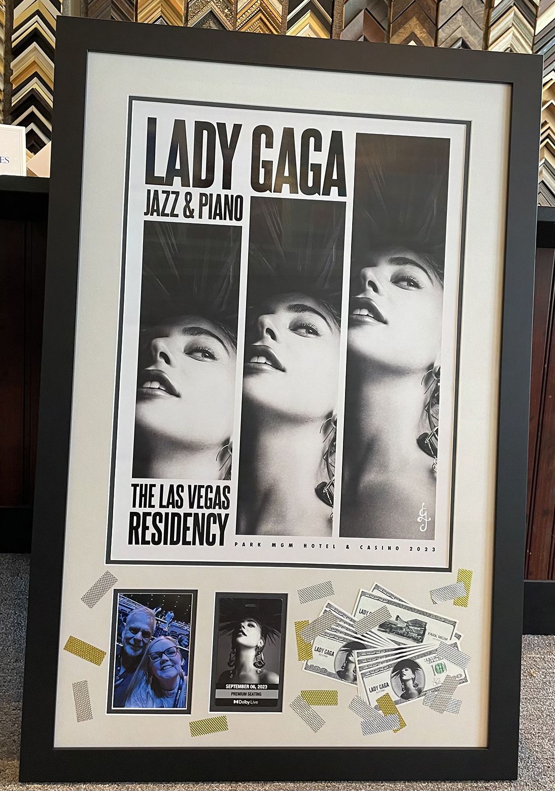 A lady gaga poster in a black frame