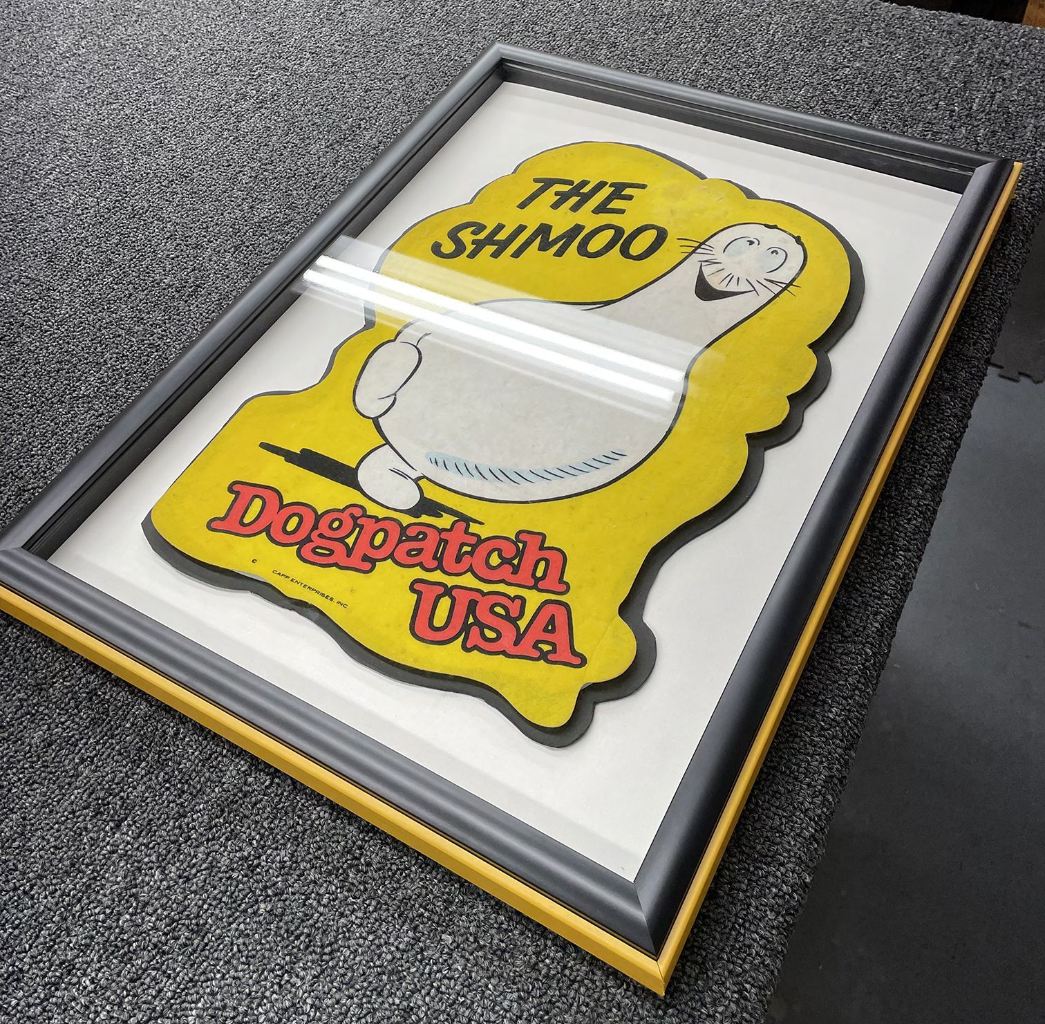 A picture in a frame that says dogpatch usa