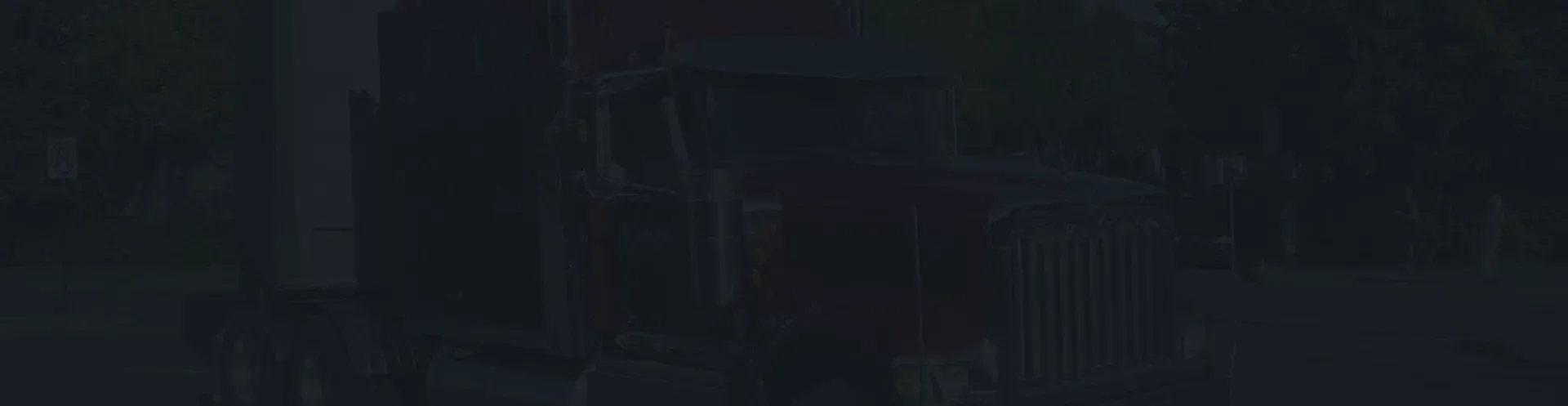 Red semi truck in background with blue overlay | CL Enterprises