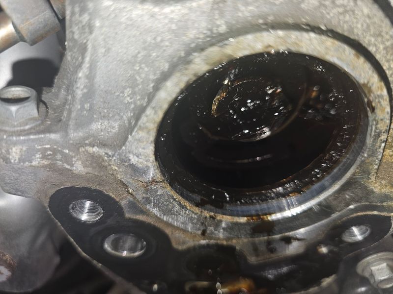 A close up of a metal object with a hole in it