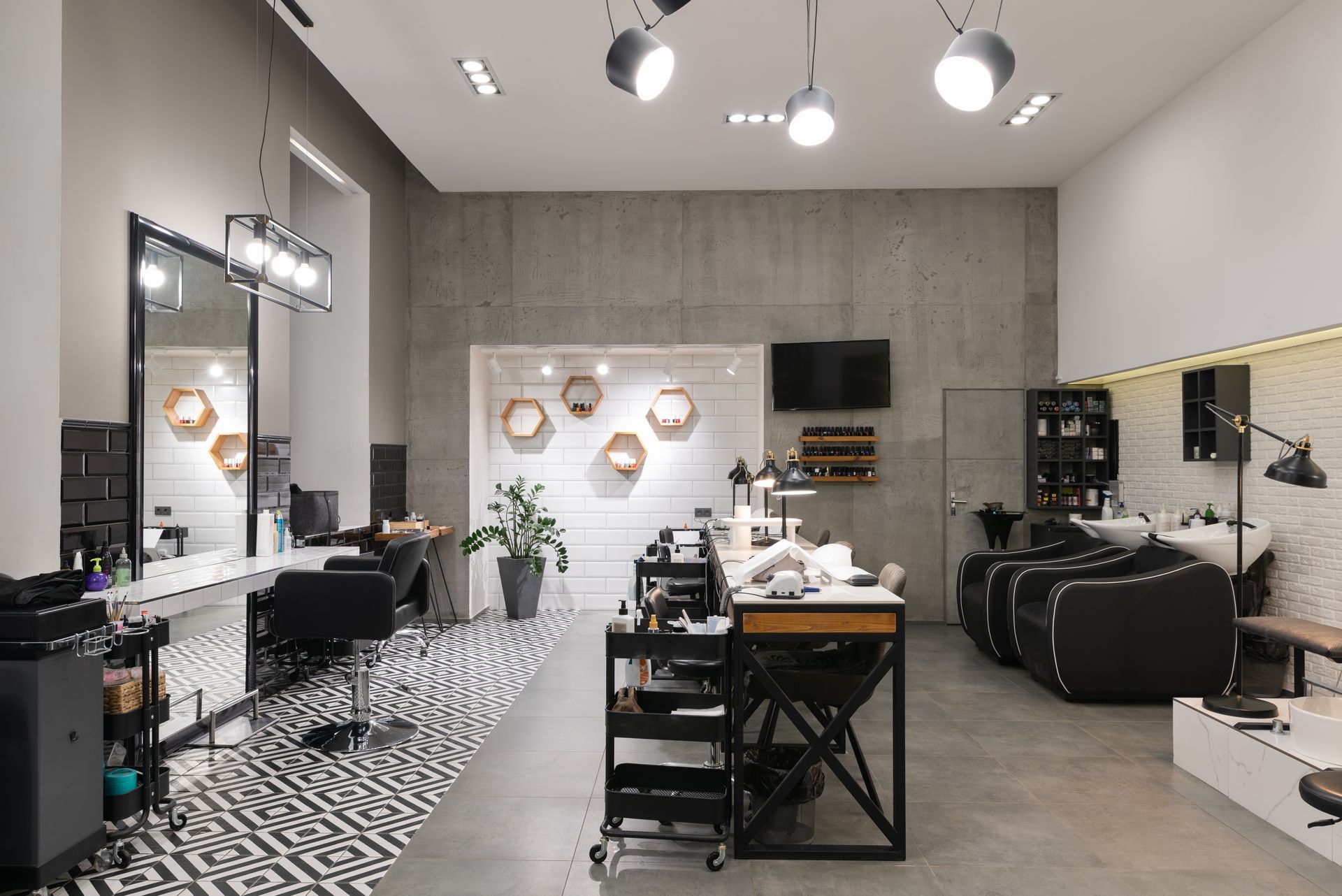 Modern hair salon interior with styling chairs, mirrors, and tools in black-and-white decor Modern hair salon interior with styling chairs, mirrors, and tools in black-and-white decor