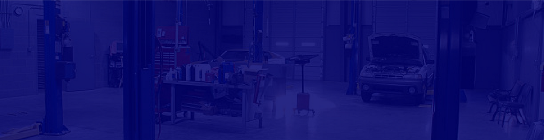 inside garage with blue overlay | East Carolina Automotive