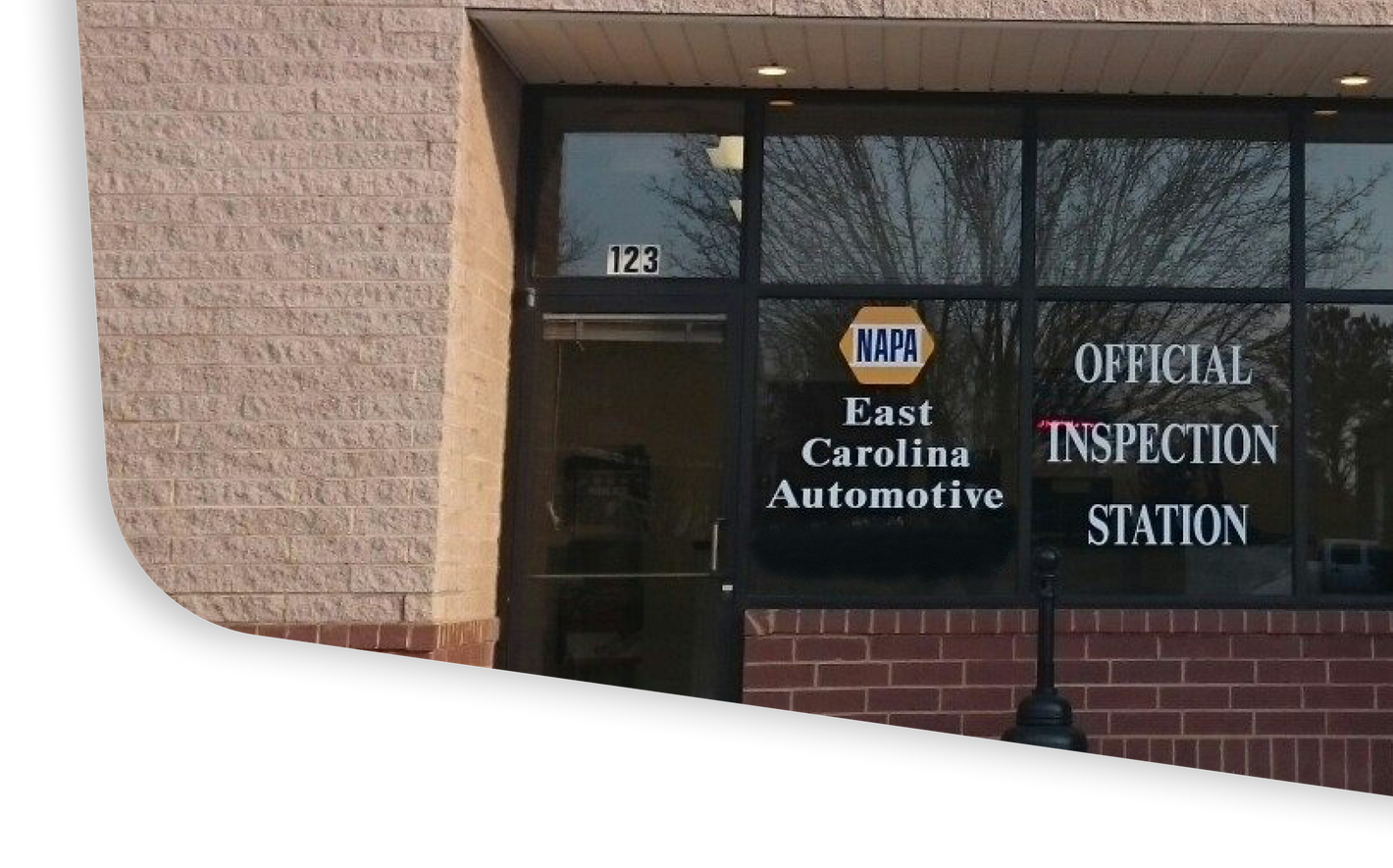 A building with a sign that says east carolina automotive | East Carolina Automotive