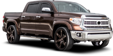 A black ford f150 truck is shown on a white background. | East Carolina Automotive