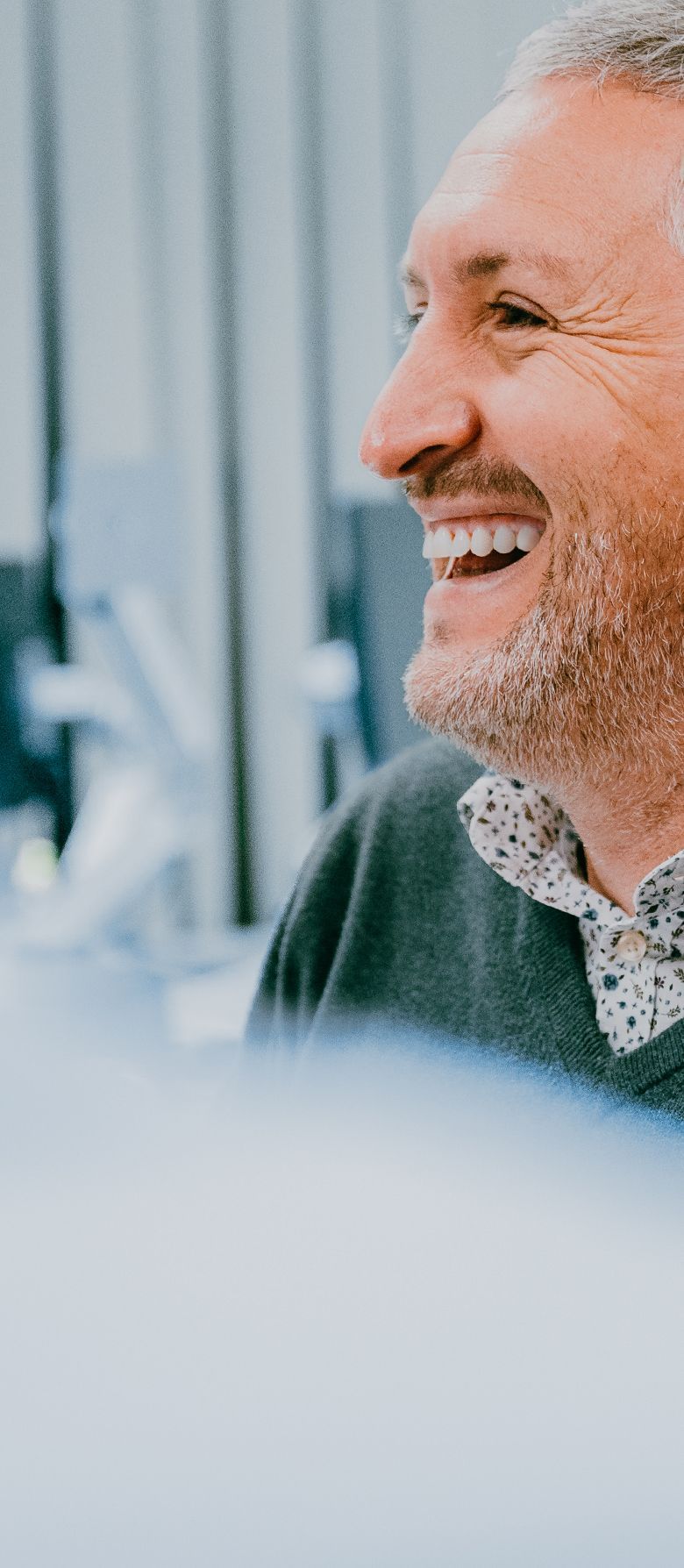 A zoi employee smiling at the camera