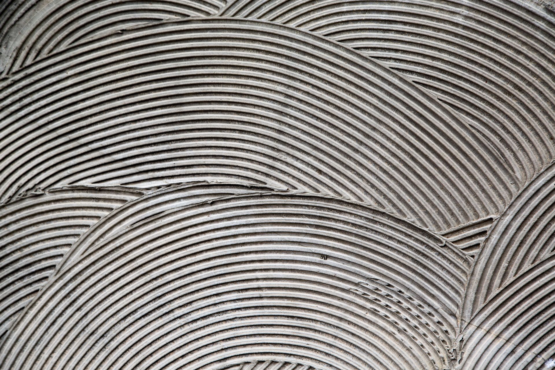 A close up of a tile adhesive on a wall.